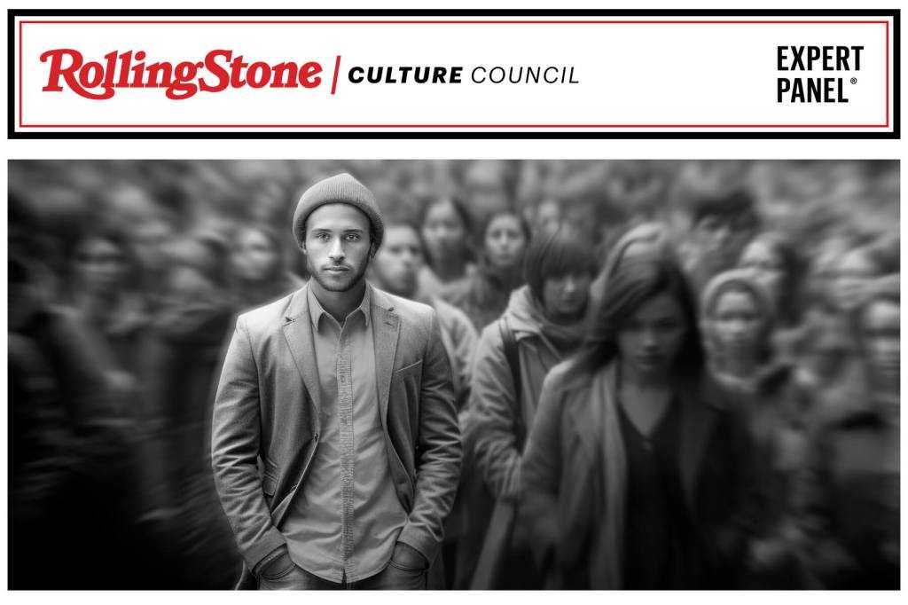 Young person stands out from a blurred background of people.