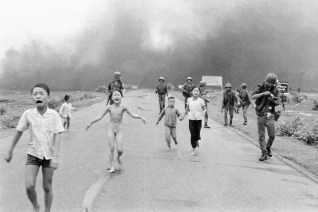 "Napalm Girl" or "Terror of War" photograph credited to Nick Ut shows Kim Phuc and Vietnamese children running after their village was bombed with napalm in the Vietnam War.